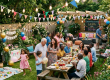 Multigenerational family enjoying a lively garden party with decorations and food
