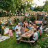 Multigenerational family enjoying a lively garden party with decorations and food